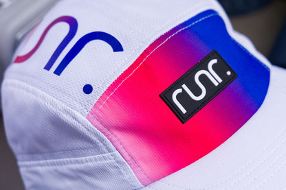 White cap with rainbow gradient side patch and runr logo badge