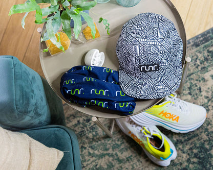 Navy and white geometric technical running hat with front logo patch