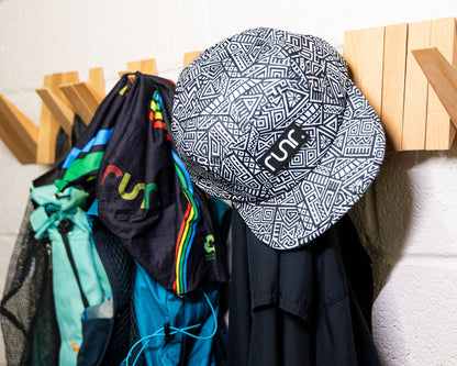 Navy and white geometric technical running hat with front logo patch