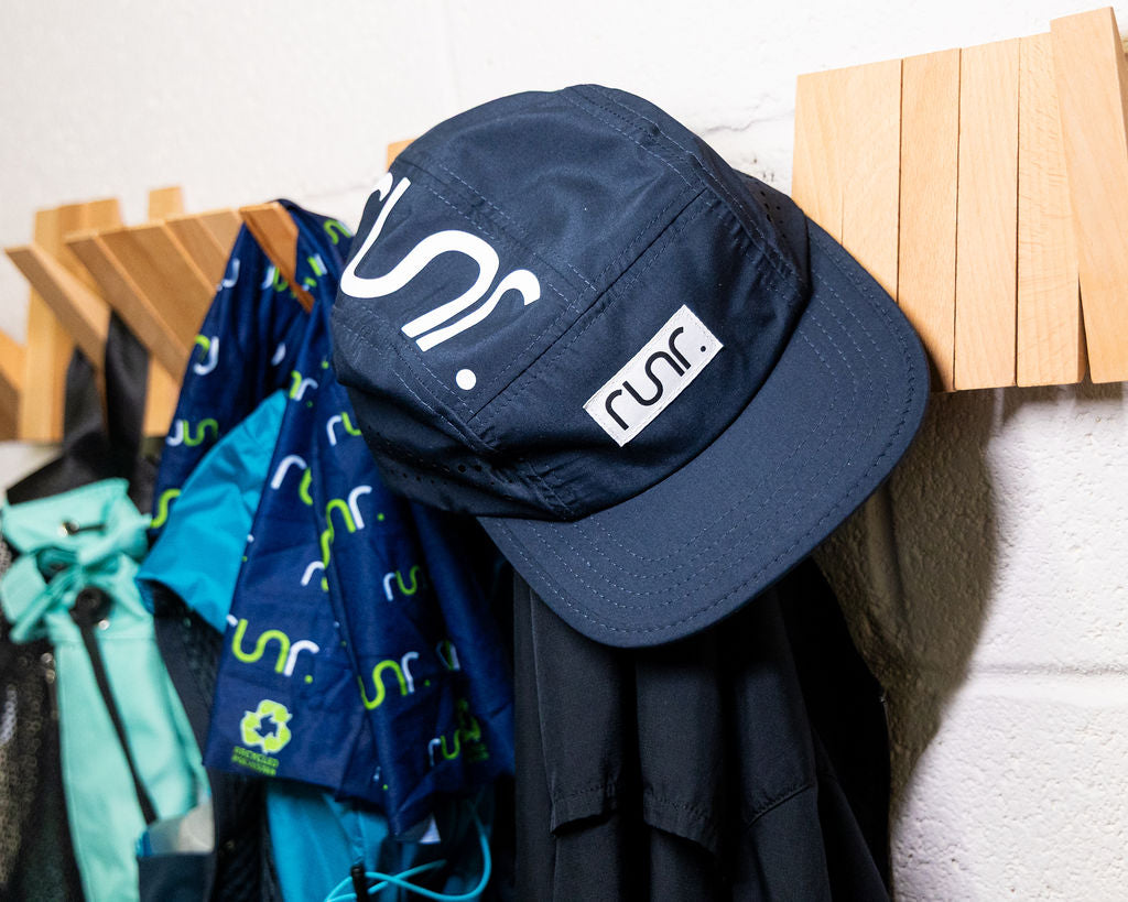 Navy running hat with large white 5 logo and rectangular runr side patch