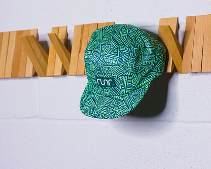 Runr technical running cap with turquoise/green geometric print, front logo patch, brim