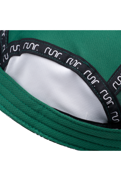 Inside view of green running hat with white lining and black-trim adjustable band.