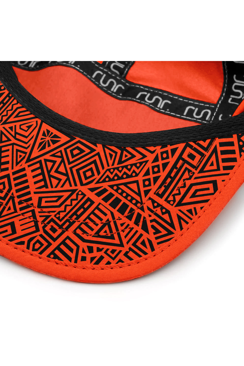 Orange cap underside with geometric inner band and patterned fabric