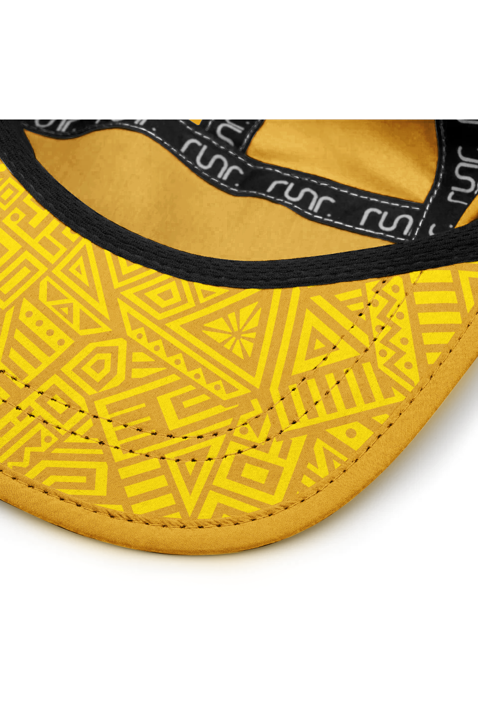 Yellow cap close-up with geometric pattern lining and black interior trim