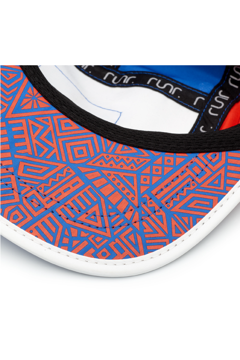 Running cap brim with orange geometric pattern and black interior band detail