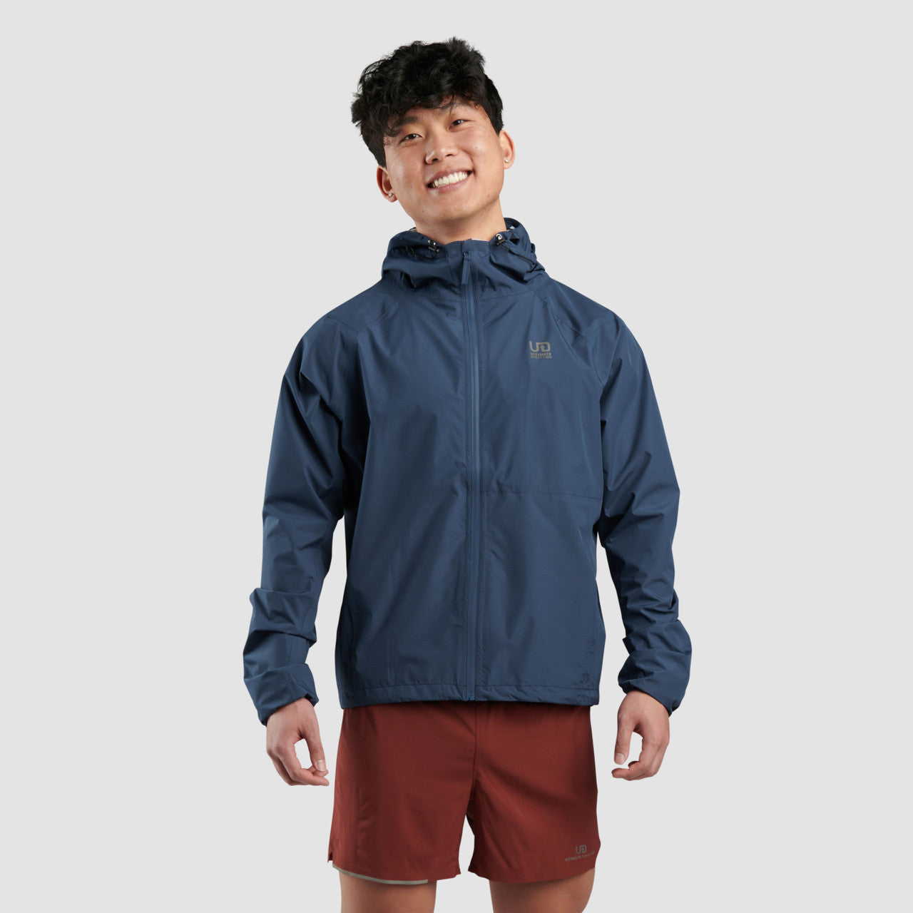 Men's blue hooded rain jacket with full-zip front and logo on chest