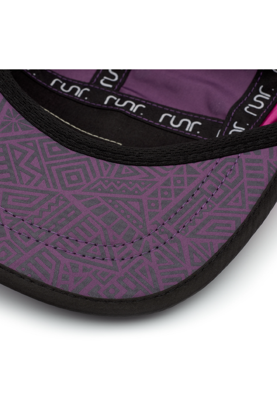 Close-up of purple patterned running hat brim with black trim and repeated logo text