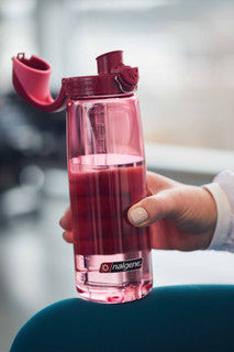 Nalgene 700ml red water bottle with straw-style lid and lock-top spout