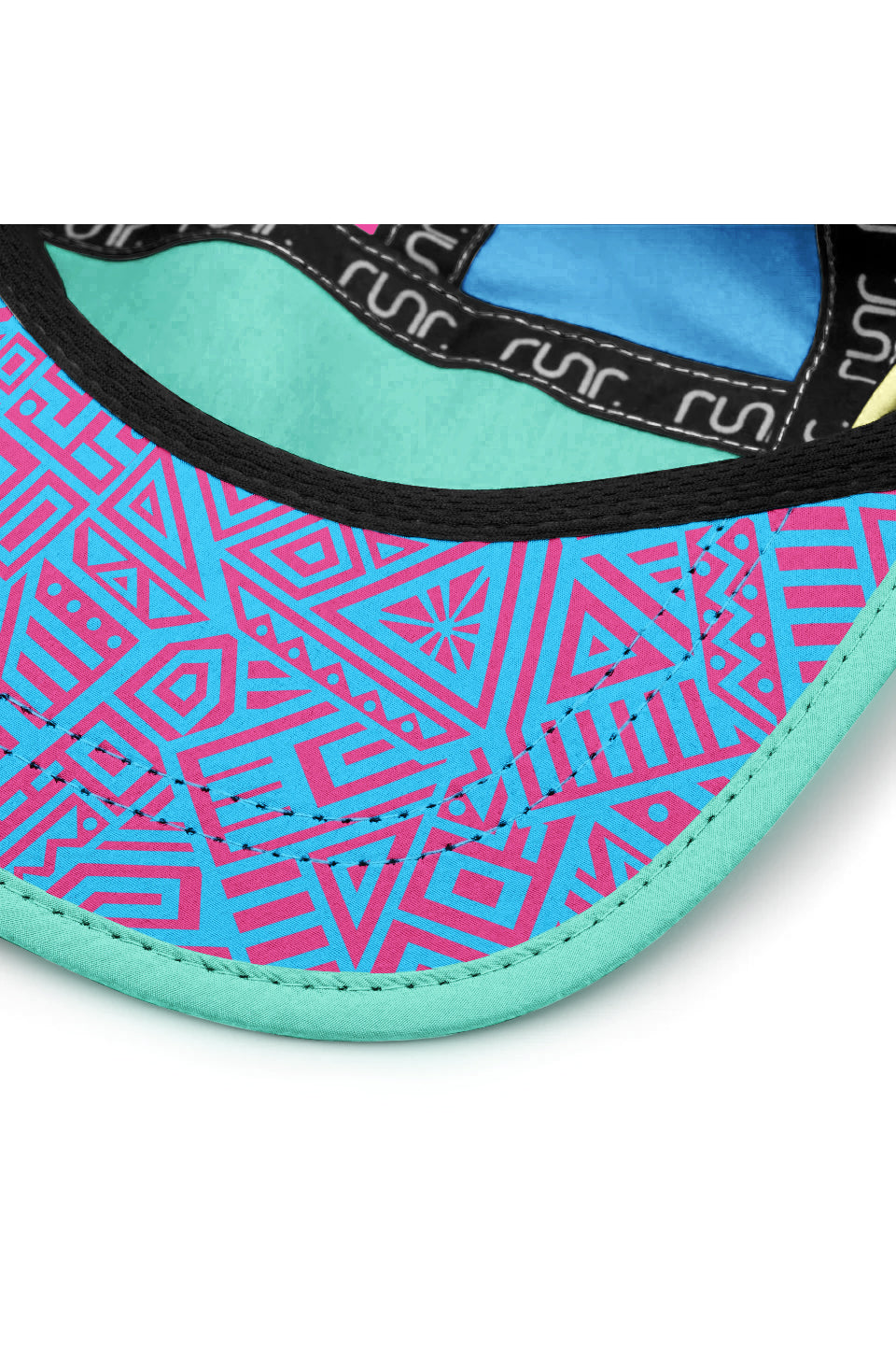 Multicolor running hat underside with stitched brim edge and patterned fabric panel.