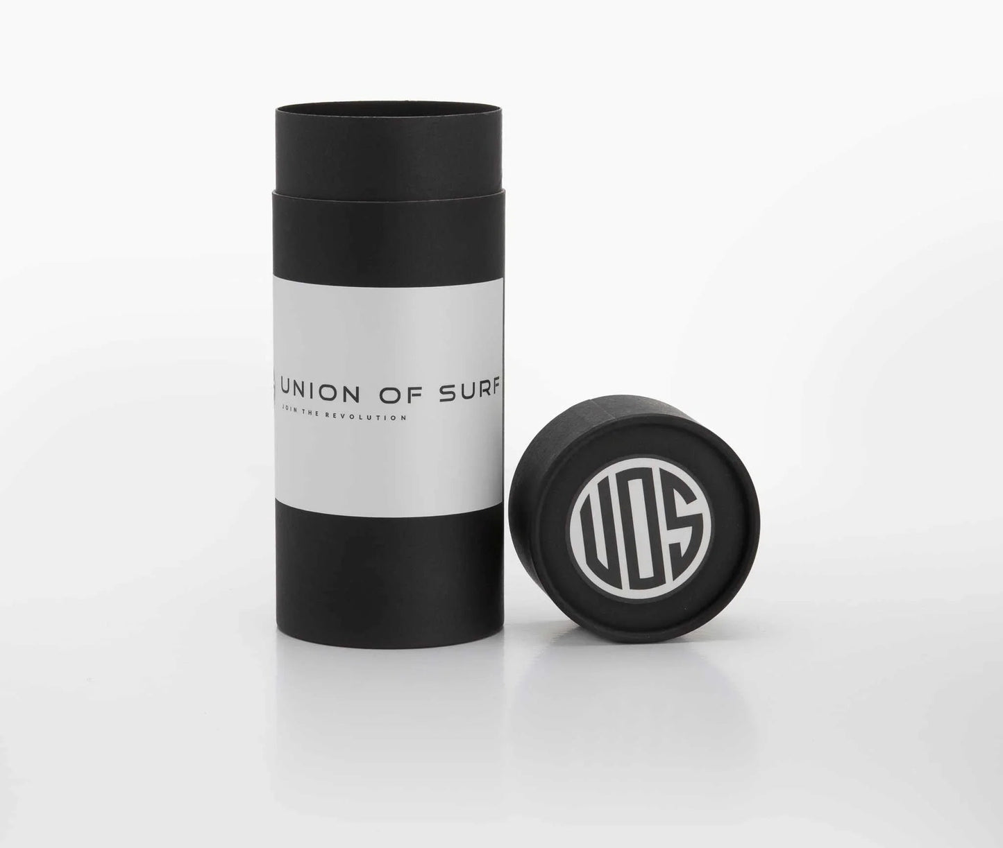 Union of Surf sunglasses case with black-and-white tube and round cap.
