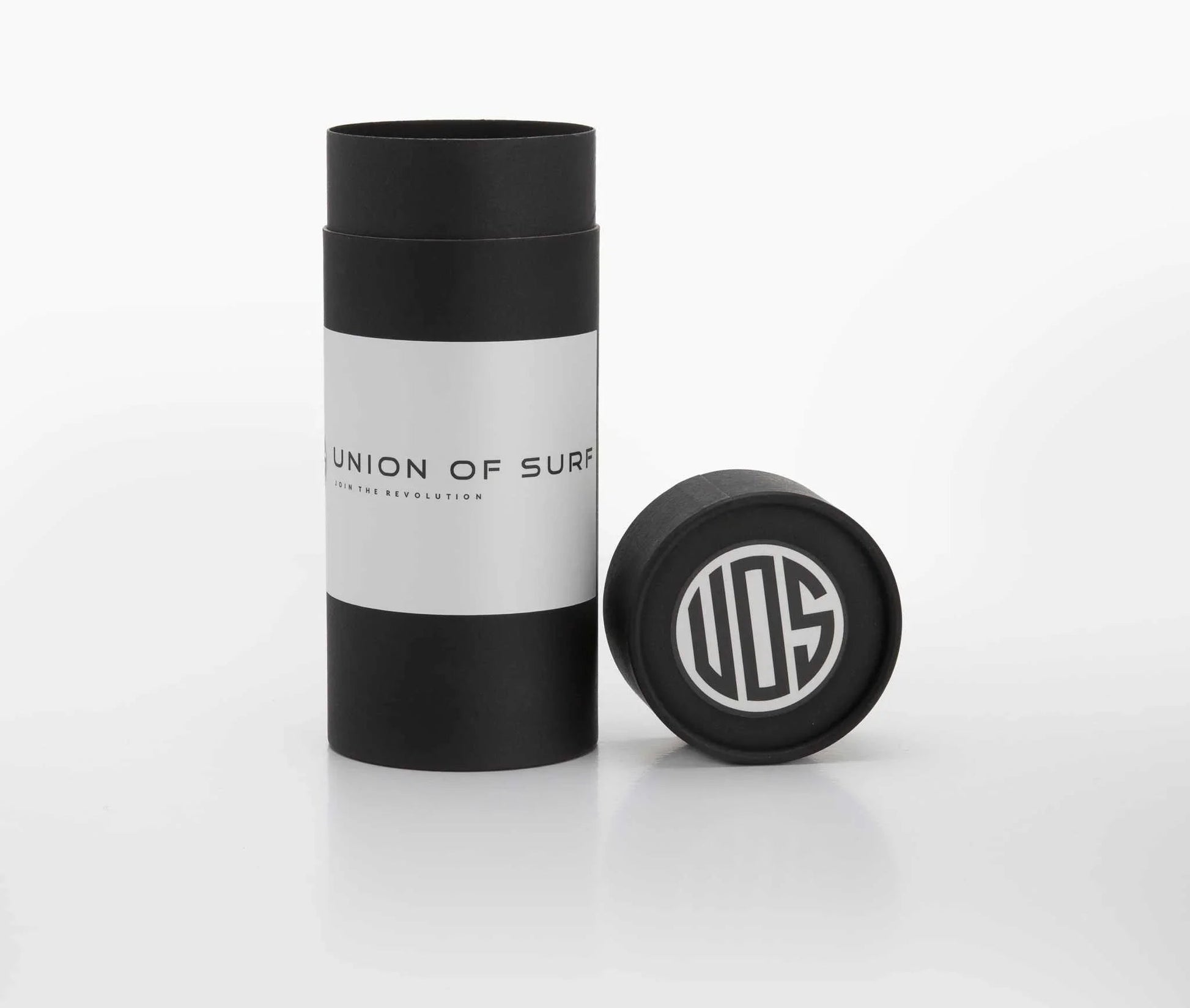 Union of Surf sunglasses case with black-and-white tube and round cap.