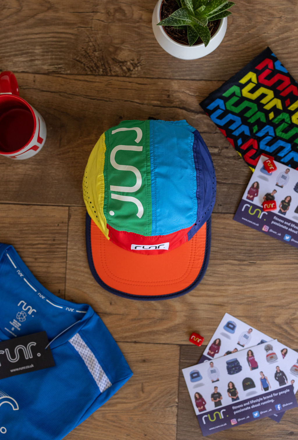 Multicolor RUNR running cap viewed from above on wooden floor