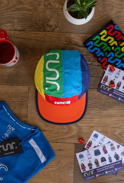 Multicolor RUNR running cap viewed from above on wooden floor