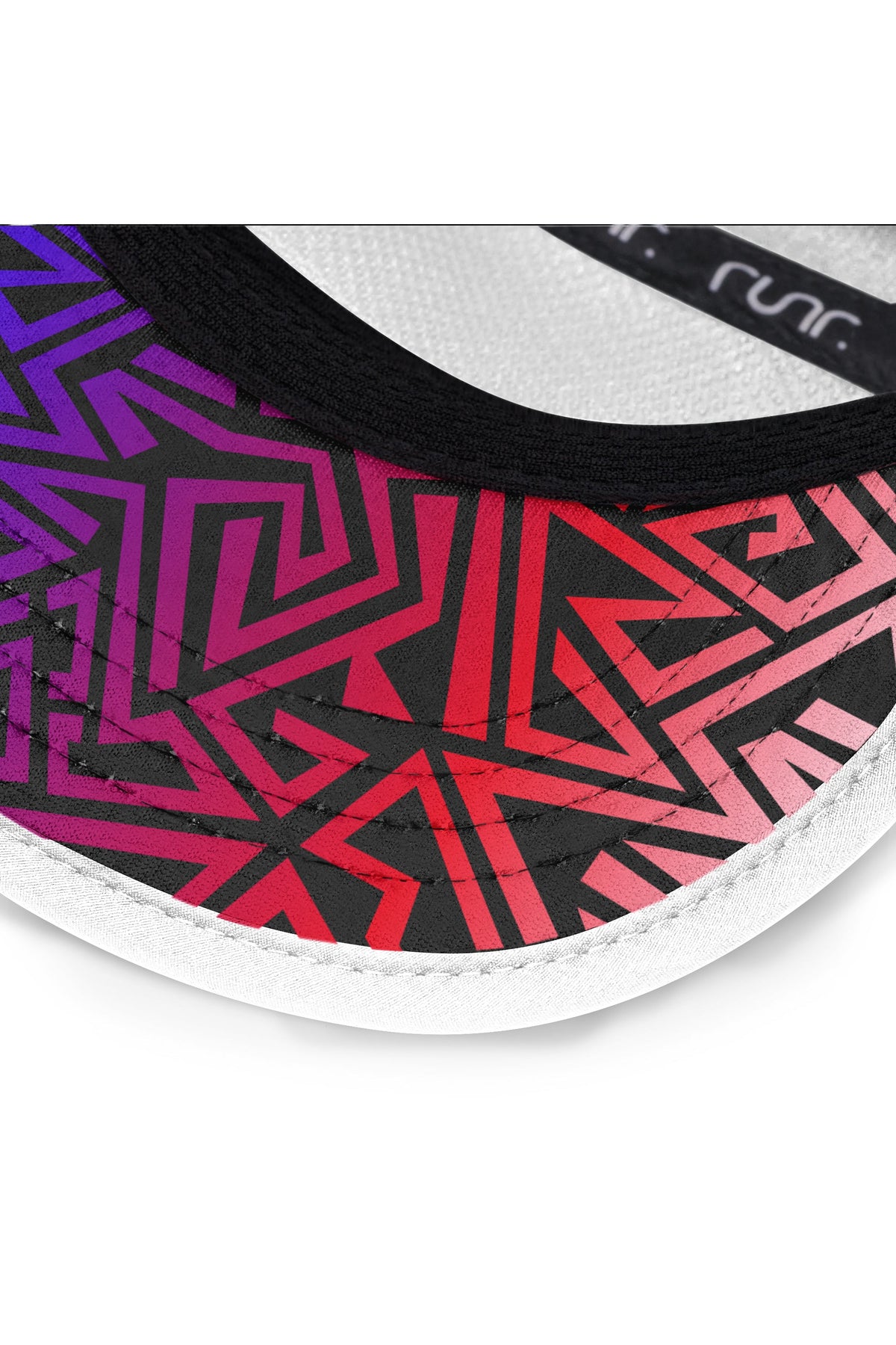 Close-up of white cap brim with purple, pink, and red geometric pattern trim