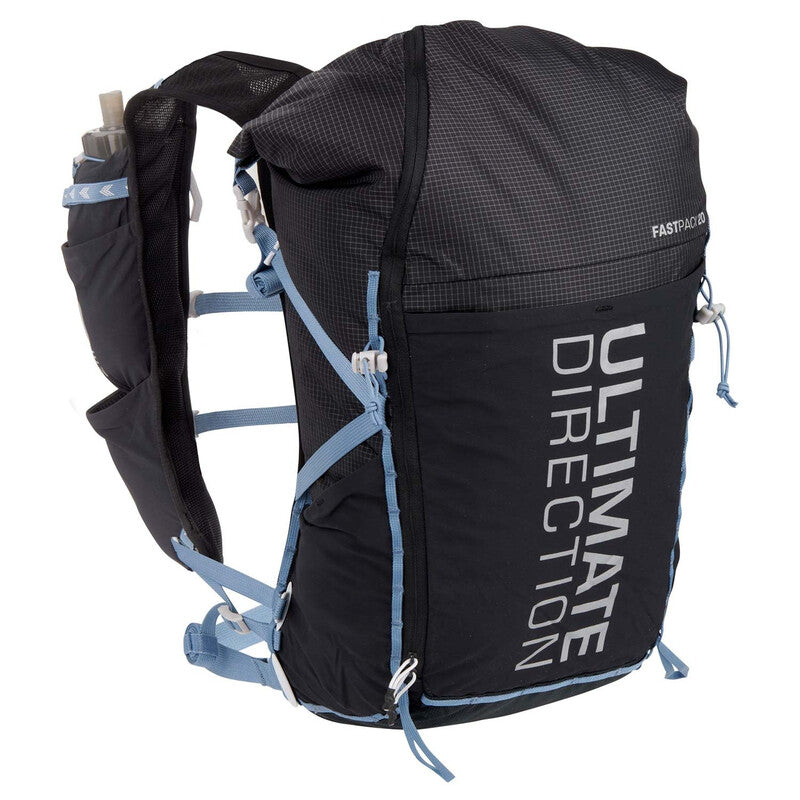 Black and blue running backpack with brand name 'Ultimate Direction' on a white back ground