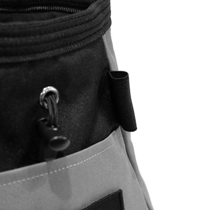 Close-up of grey chalk bucket with black pull cord and metal grommet