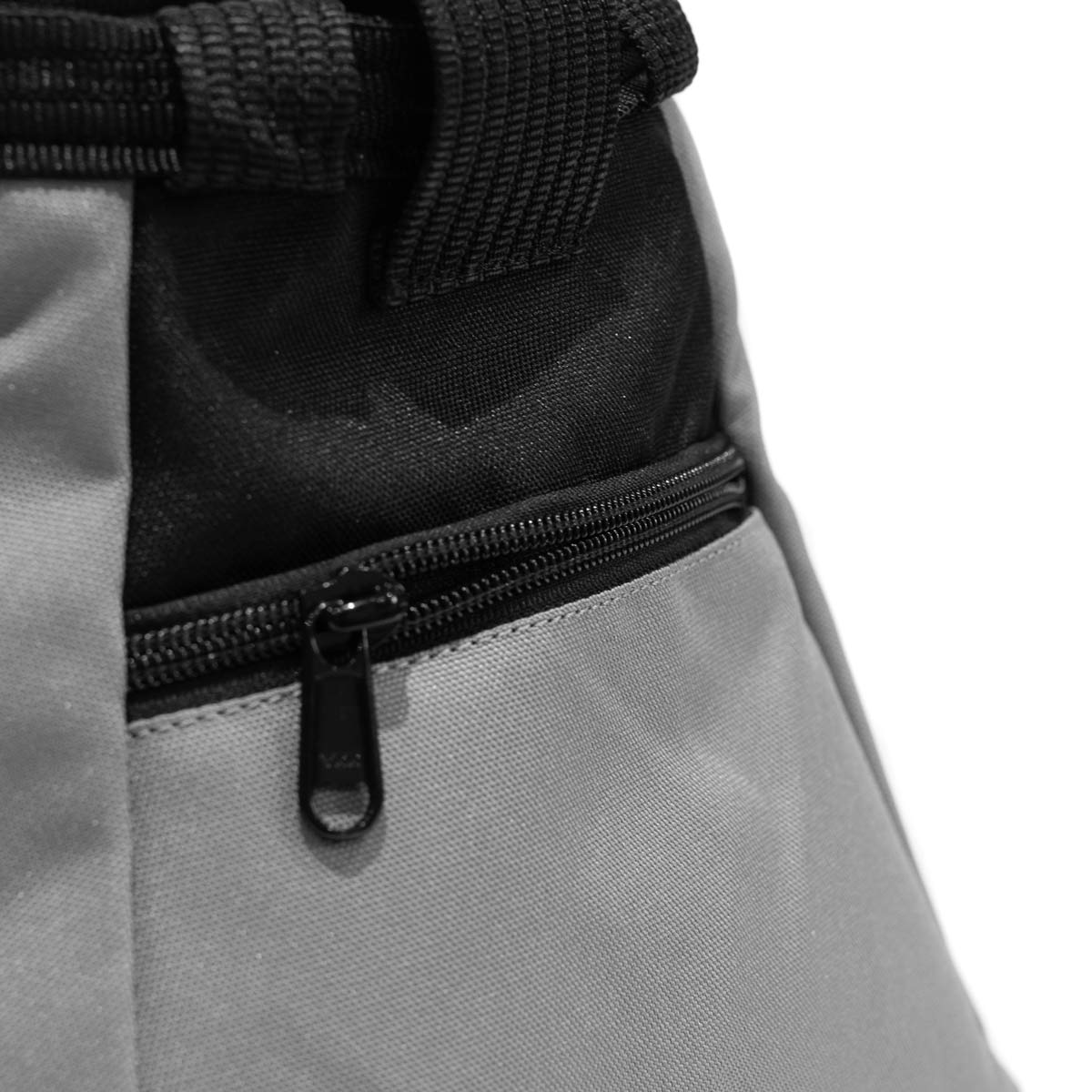 Grey chalk bucket with black zipper on front pocket and small loop pull