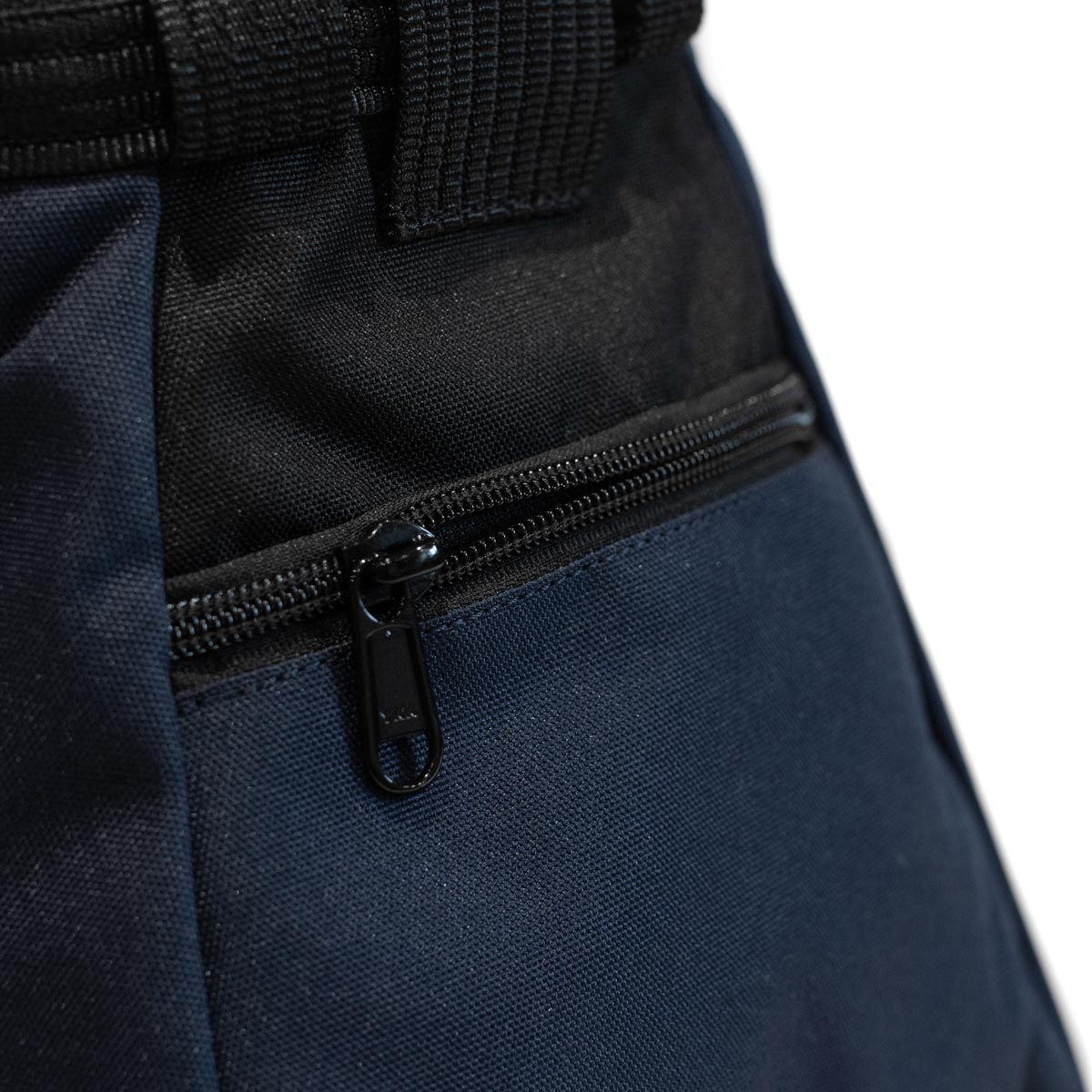 Navy chalk bucket with front zipper pocket and black webbing trim