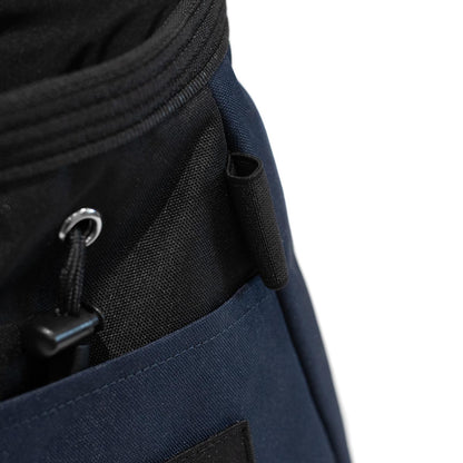 Navy chalk bucket side pocket with black mesh panel and metal grommet