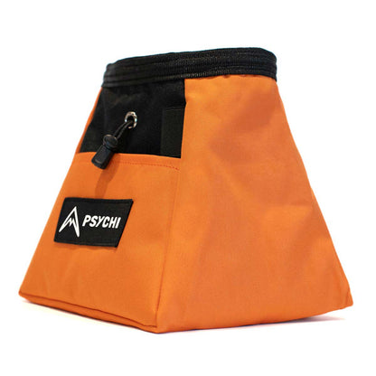 Orange chalk bucket with black drawstring, carabiner clip, and PSYCHI label
