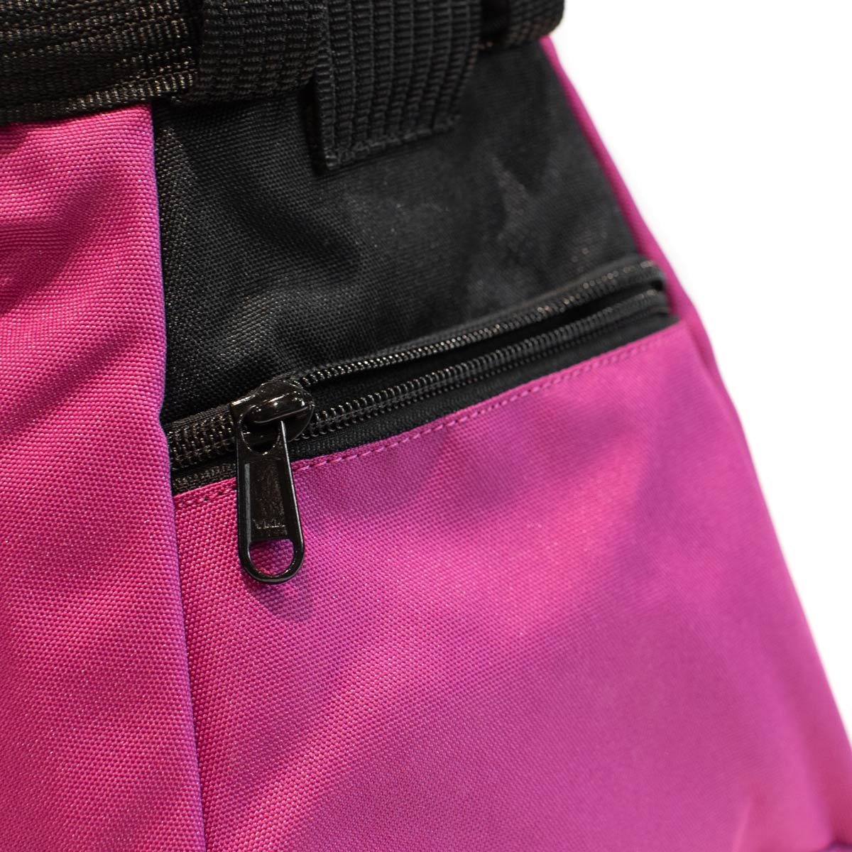 Close-up of black zipper pocket on purple bouldering chalk bucket