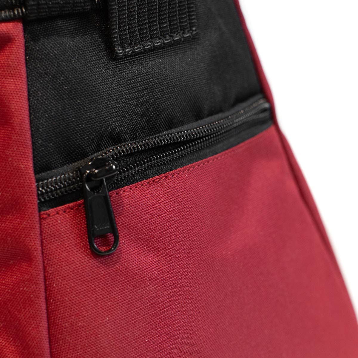 Bouldering chalk bucket, red body with black zip pocket and metal zipper pull