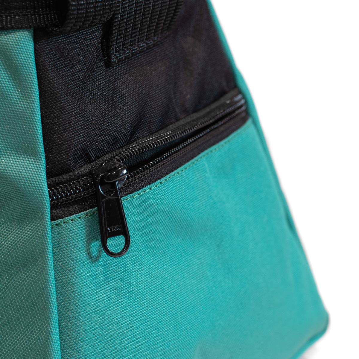 Bouldering chalk bucket close-up, turquoise fabric with black front zipper pocket