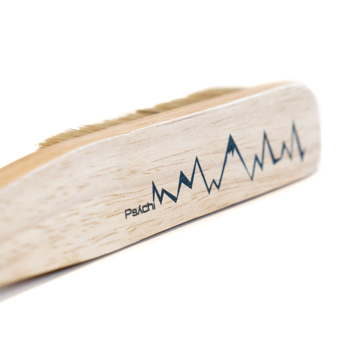 Climbing brush with mountain graphic on wood handle and tan bristles