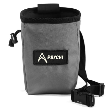 Grey climbing chalk bag with black top band, logo patch, and adjustable shoulder strap