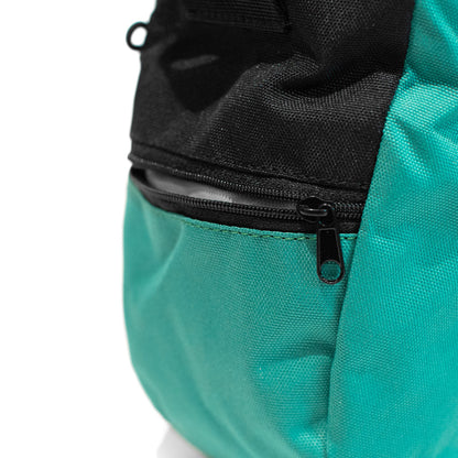 Turquoise climbing chalk bag close-up with black zipper and metal pull