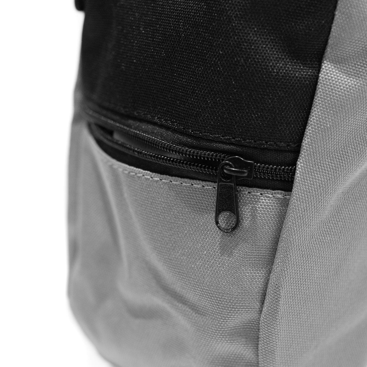 Grey climbing chalk bag with black zipper and contrasting black top fabric