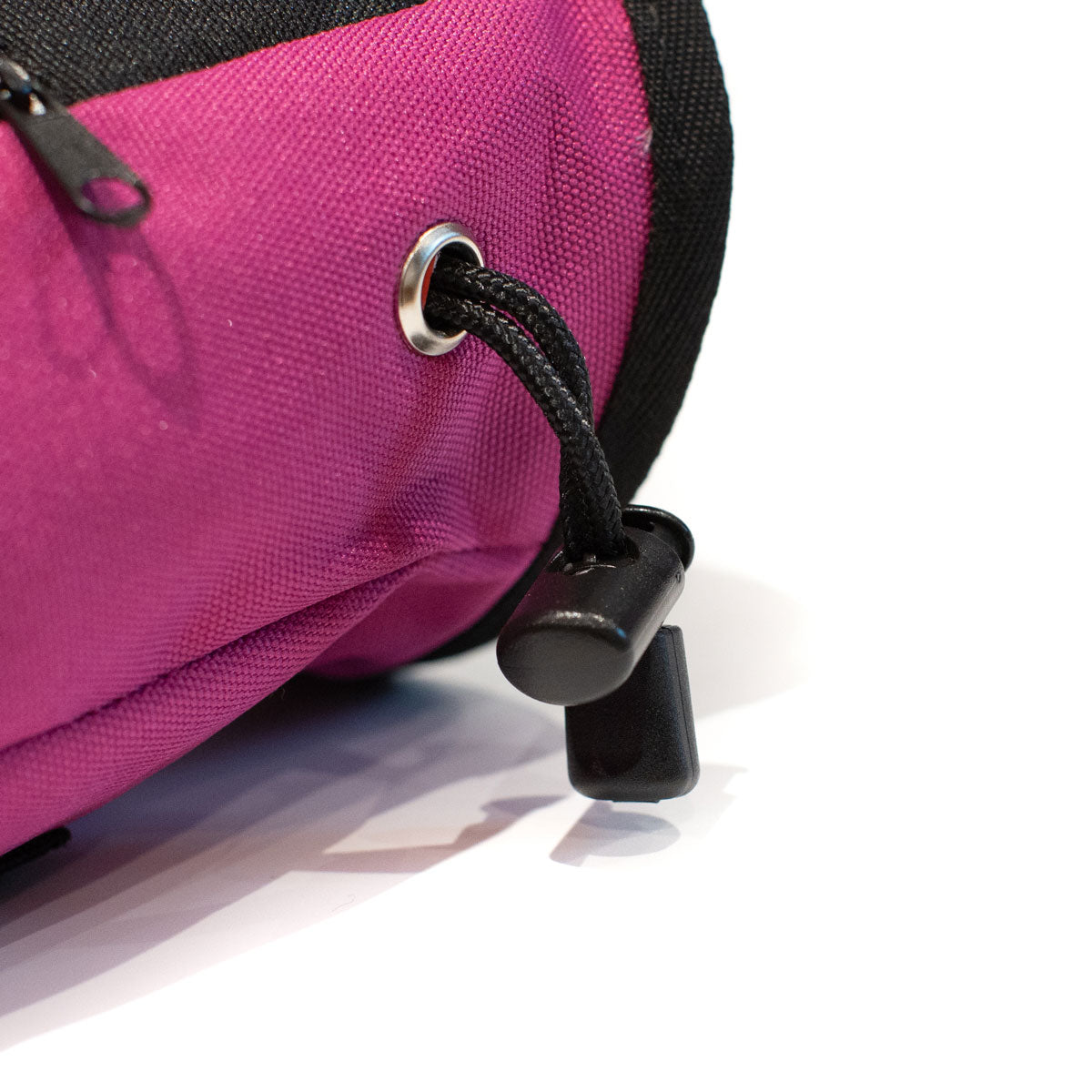 Magenta climbing chalk bag with metal grommet and adjustable drawstring pull