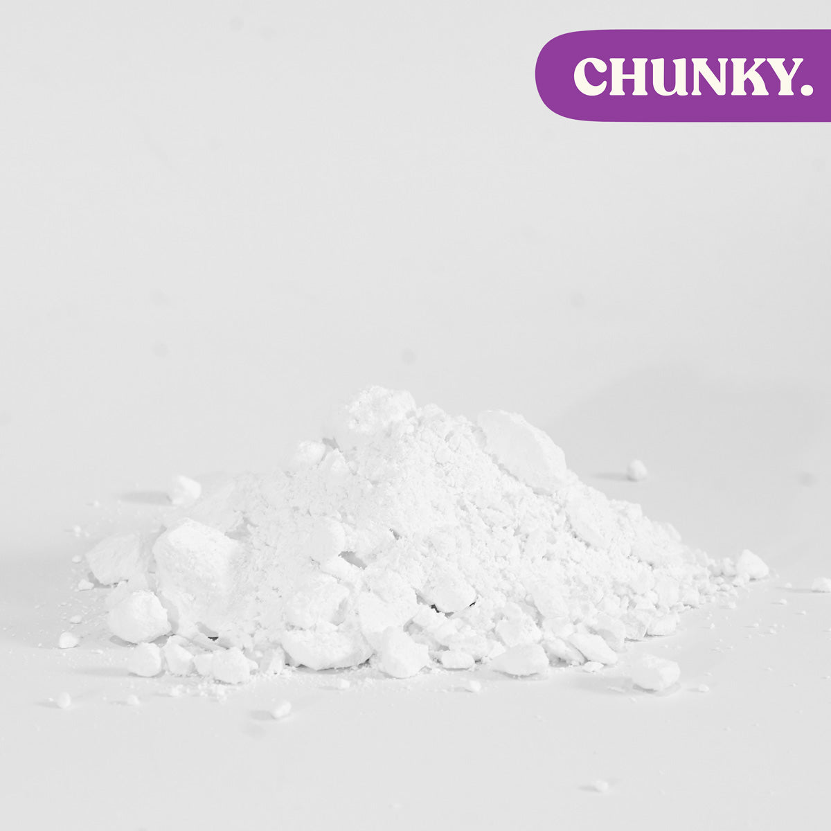 Chunky white climbing chalk powder pile