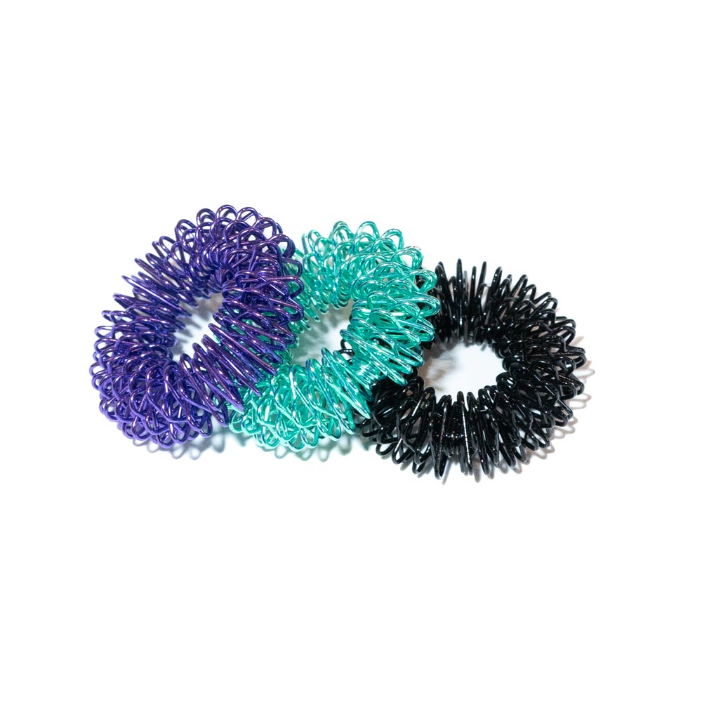 Three-color finger coil massager set with purple, teal, and black spring rings