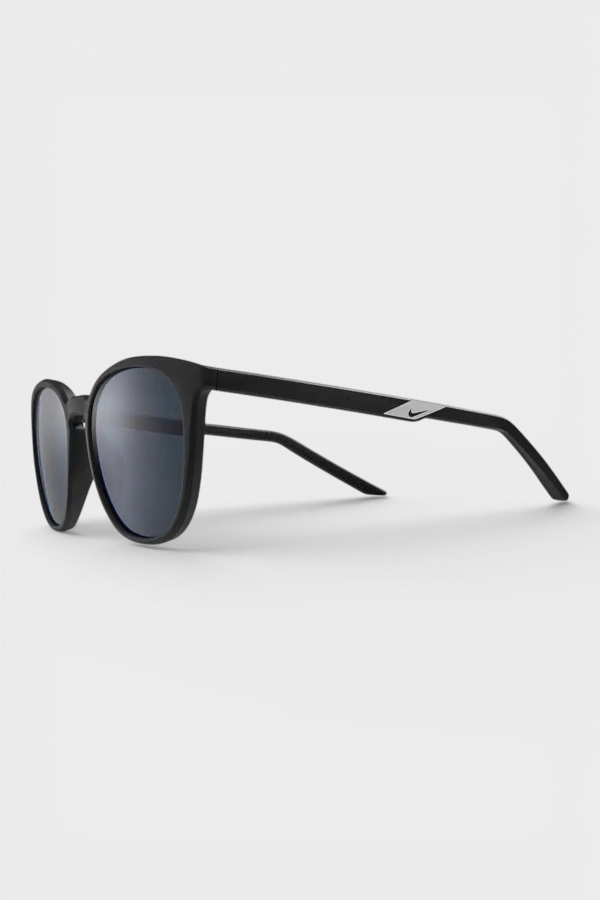 Nike matte black sunglasses with dark grey lenses, side view