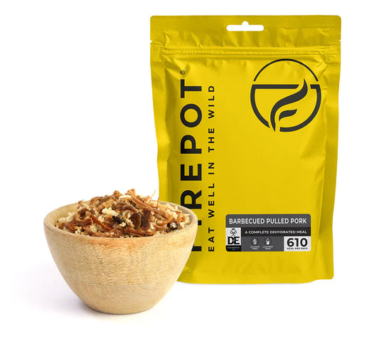 Dehydrated barbecued pulled pork pouch with bowl of shredded pork and sauce