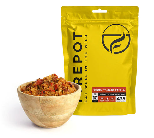Dehydrated smoky tomato paella in yellow stand-up pouch with serving bowl of rice