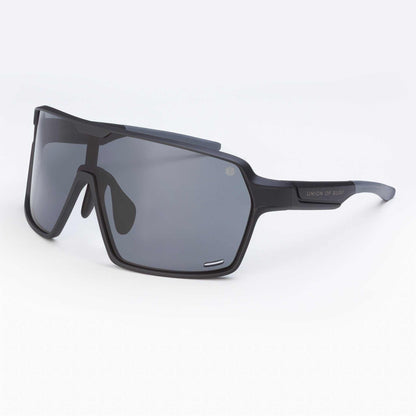 Black wraparound sport sunglasses with dark gray lenses, angled side profile