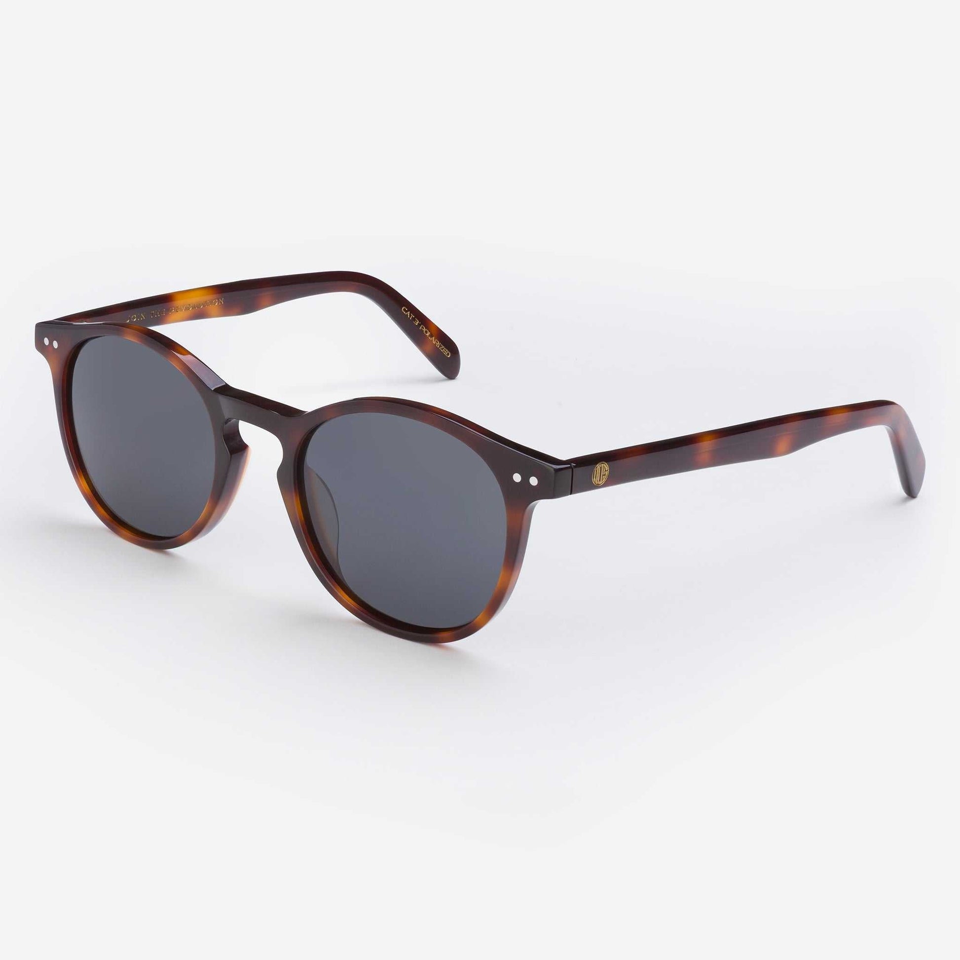 Tortoise shell sunglasses with dark round lenses and slim curved arms