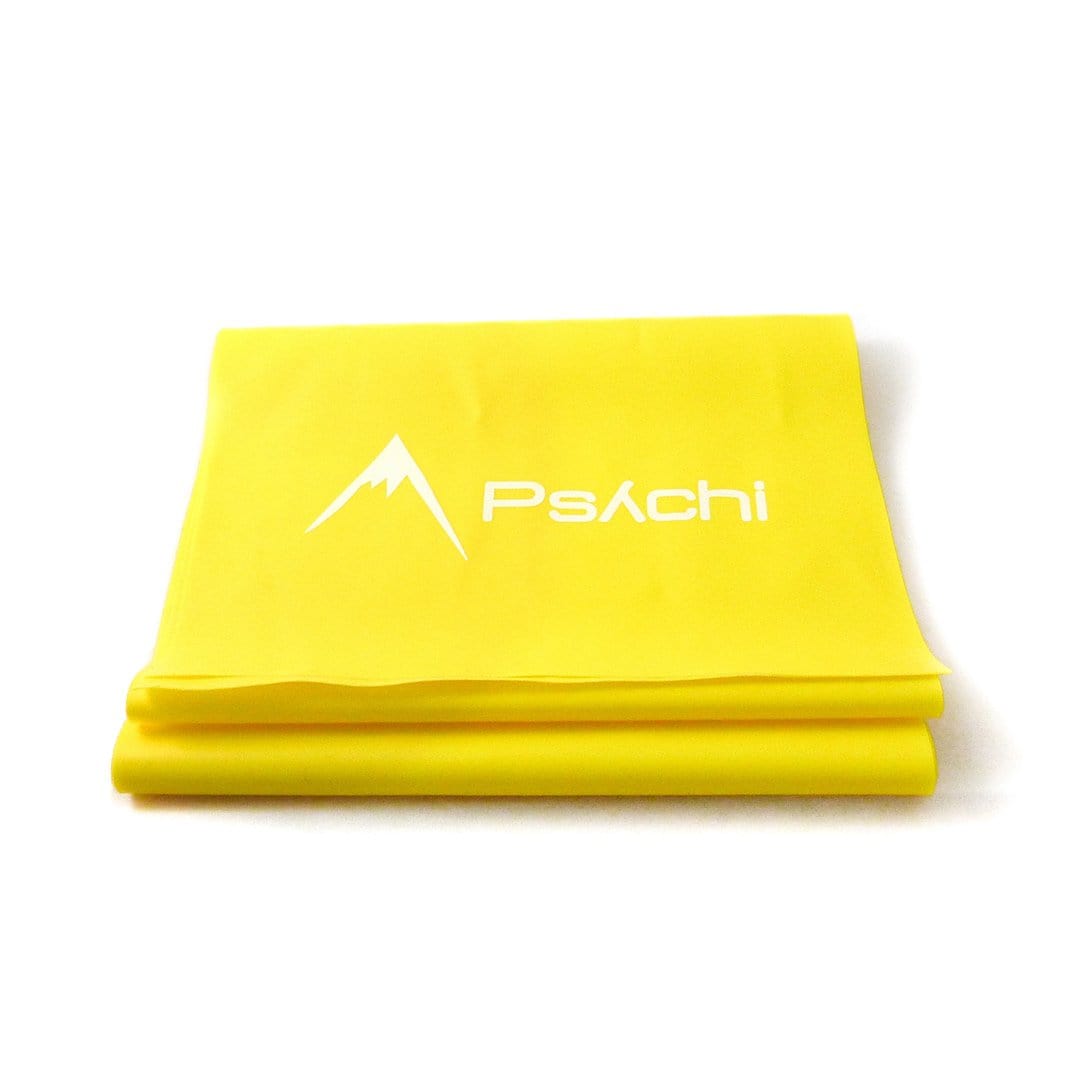Yellow resistance band with Psachi logo, folded into a compact stack