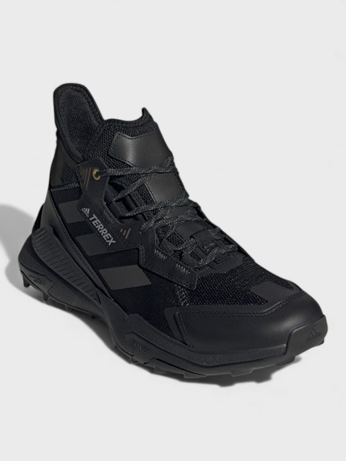 Black mid-top lace-up trail boots with three-stripe side panels and padded collar