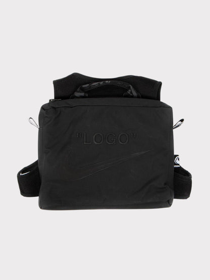 Black Nike crossbody bag with embossed "LOGO" and top carry handles