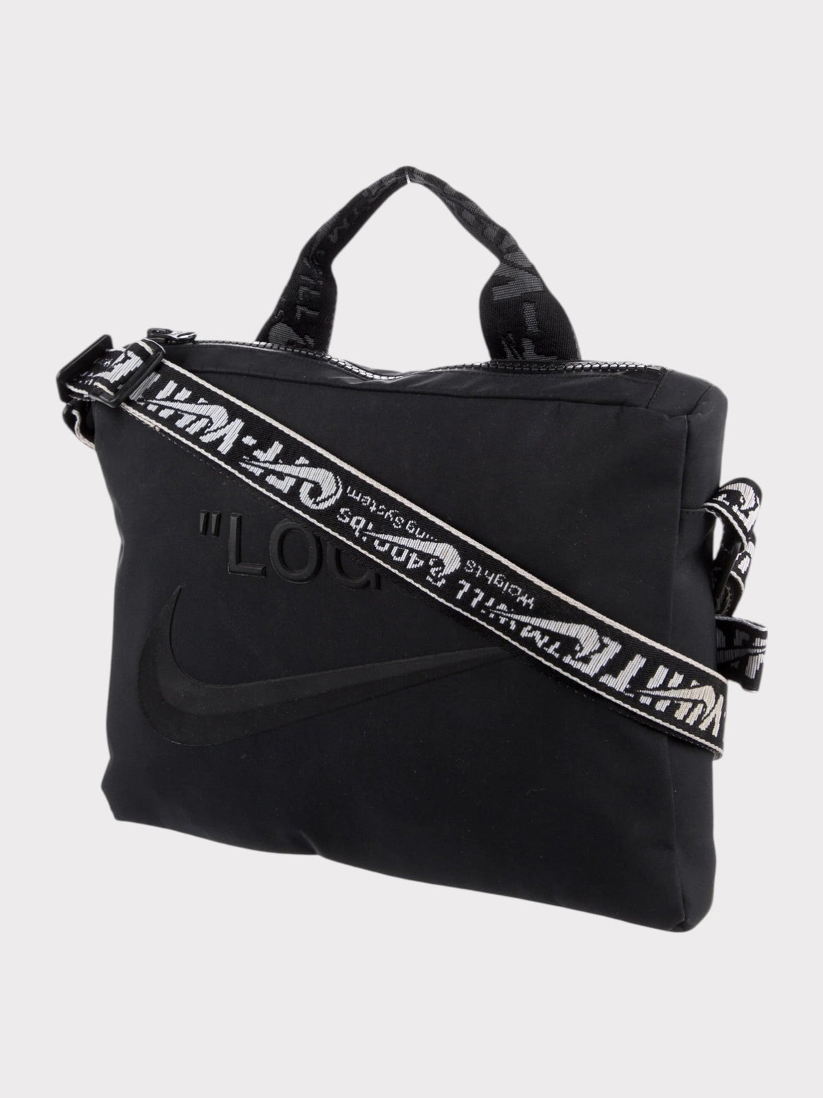 Black Nike duffel with wide strap and large swoosh graphic across front