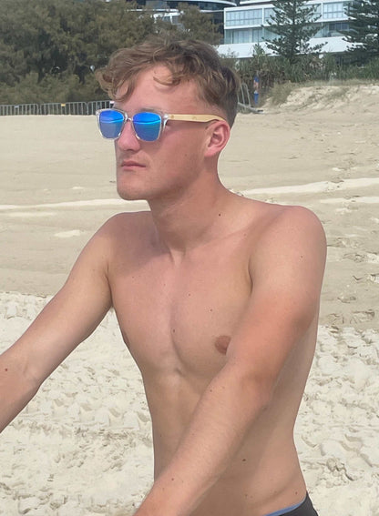 Sky blue mirrored sunglasses with slim metal frame and blue lenses