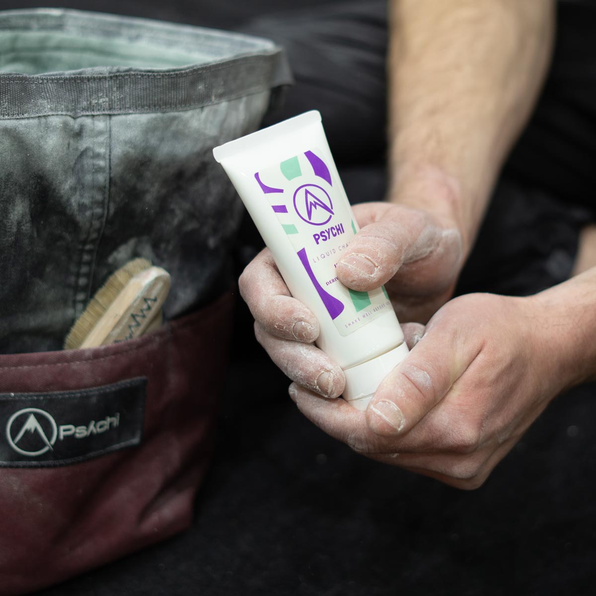 Psychi liquid chalk tube held in hand