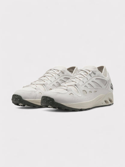 Nike ACG low-top trail sneakers in white, lace-up with rugged rubber sole