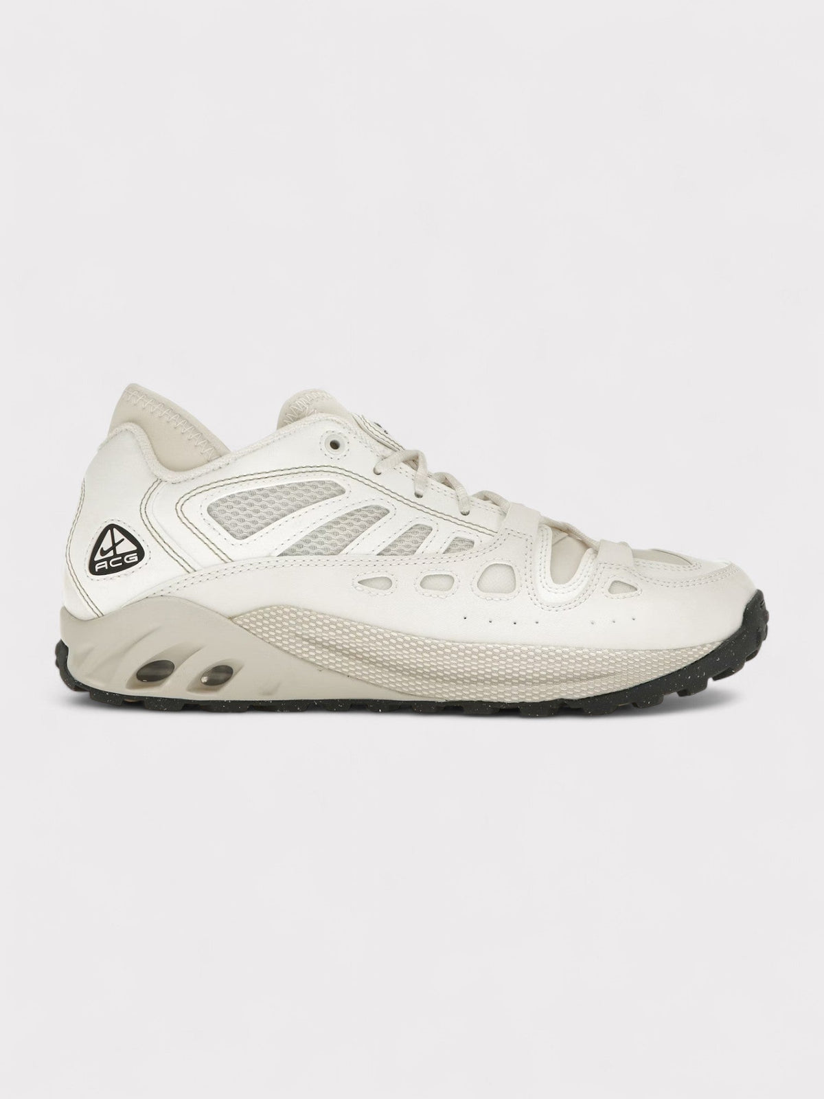 Nike ACG lace-up trail sneakers, white with mesh panels and dark rugged outsole