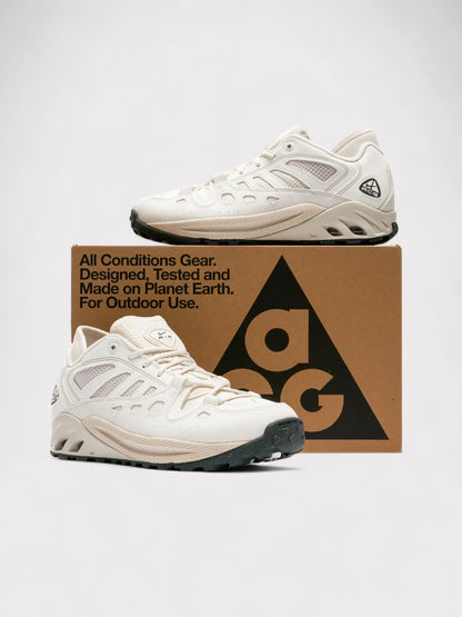 Nike ACG lace-up trail sneakers in white with cushioned sole and side accents