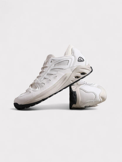 Nike ACG lace-up trail sneakers, side view in white with dark outsole