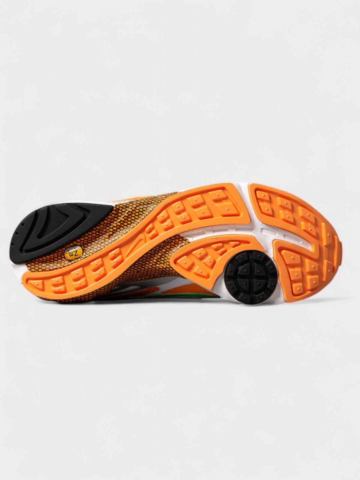 Nike shoe outsole, orange and black tread pattern underside